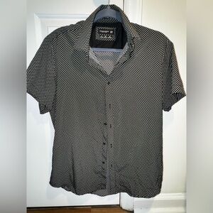 Black short sleeve button down with green and white pattern